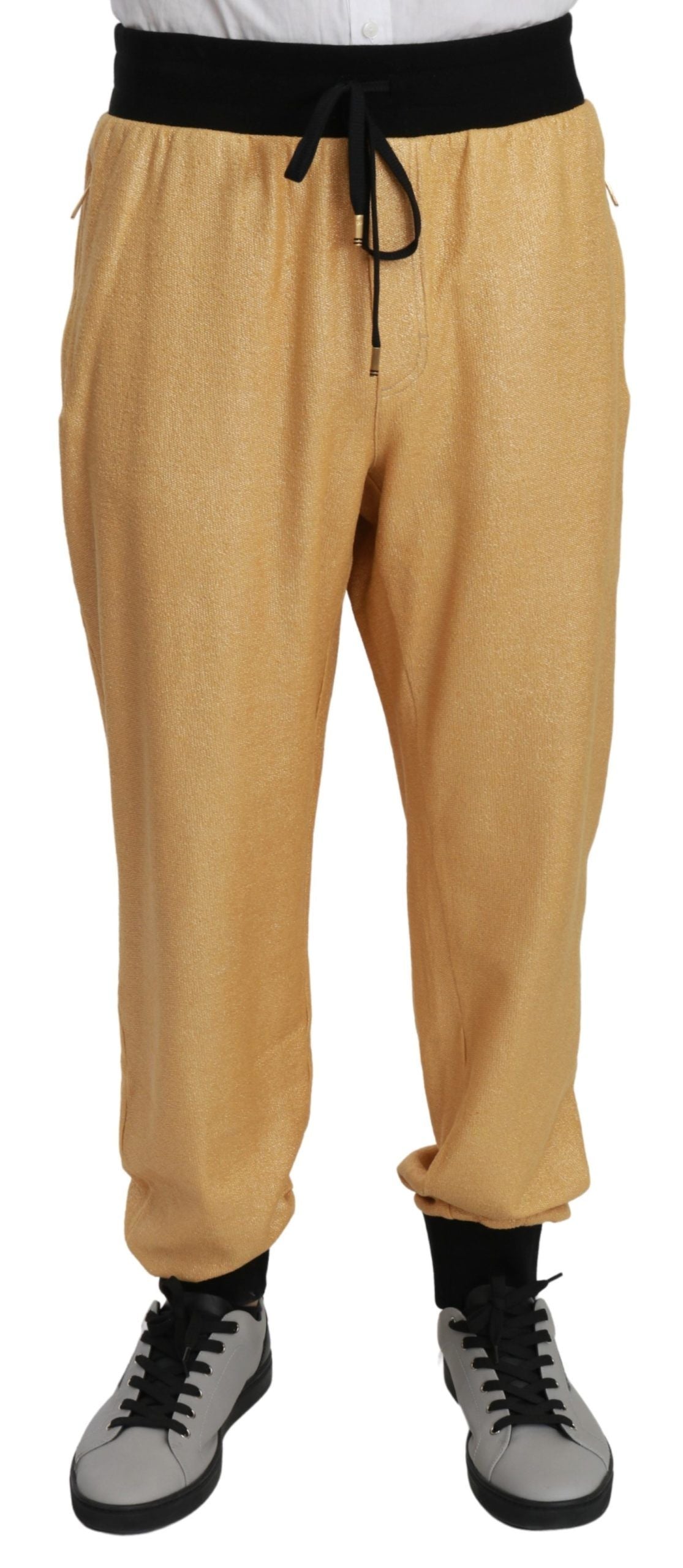 Pantalones deportivos elegantes con motivo dorado