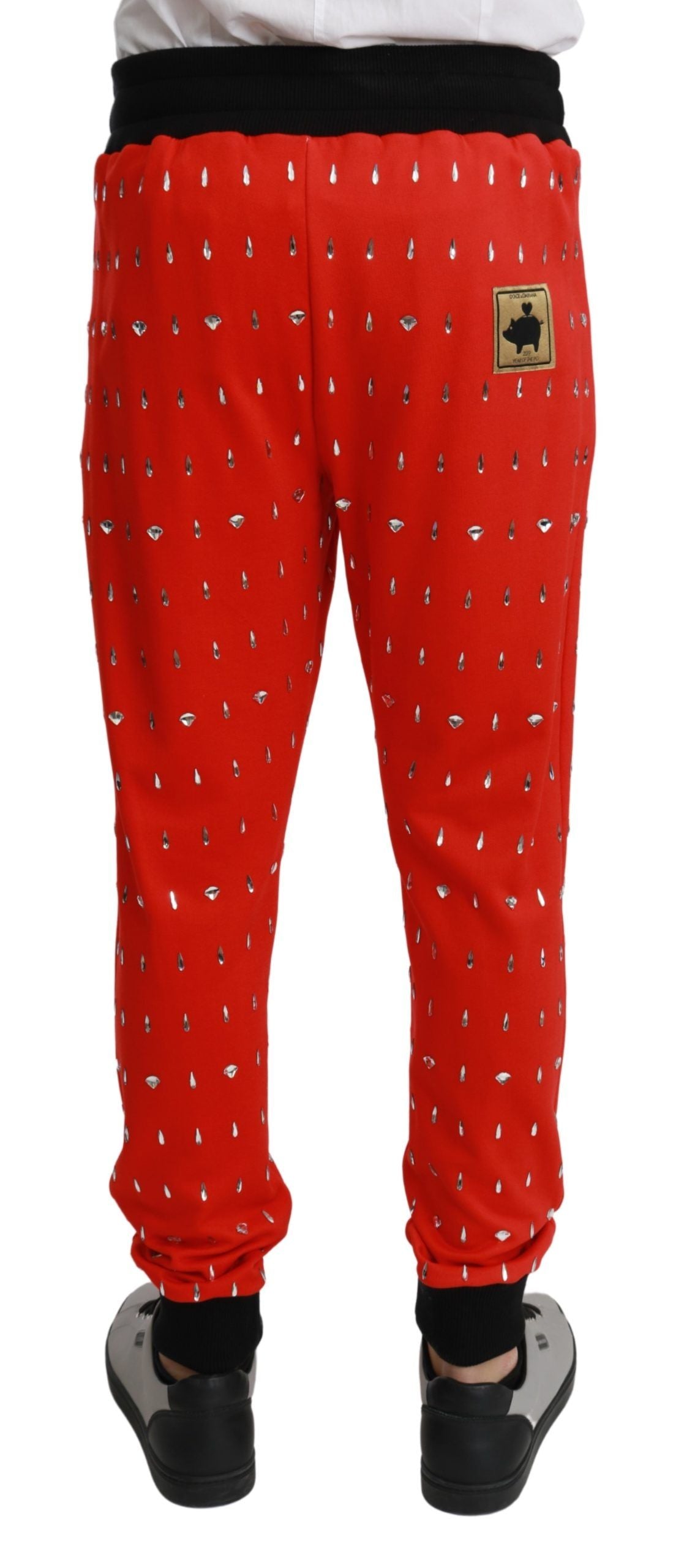 Chique rode joggingbroek met spaarvarkenprint