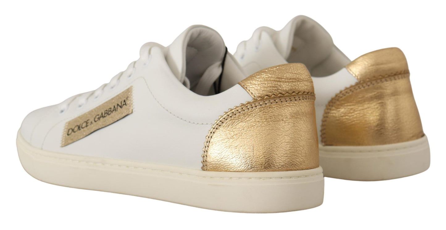 Elegante witte lederen sneakers met gouden accenten