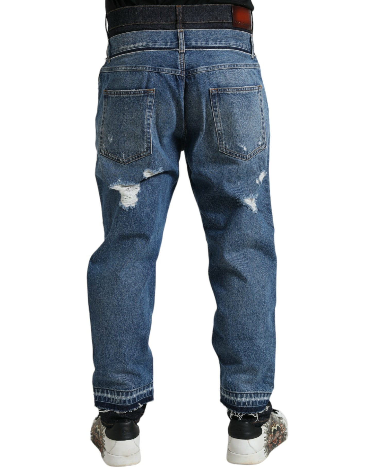 Blauwe gescheurde katoenen herendenimjeans