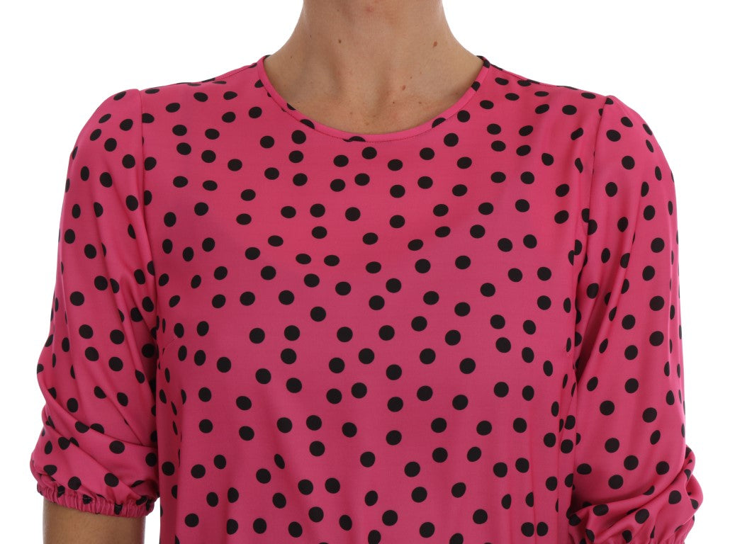 Blusa de seda rosa elegante con lunares