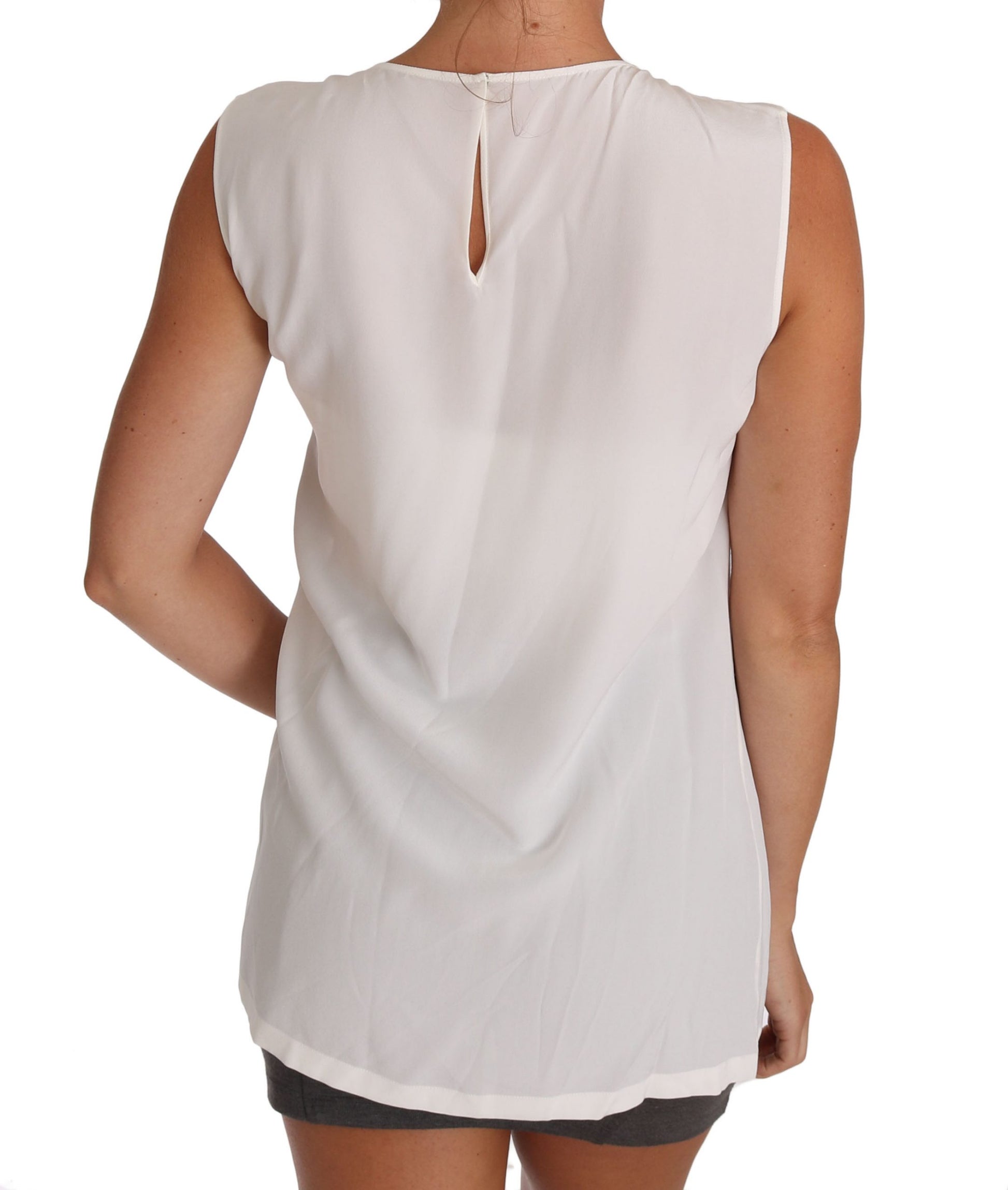 Elegante top sin mangas de seda blanca con detalle de encaje