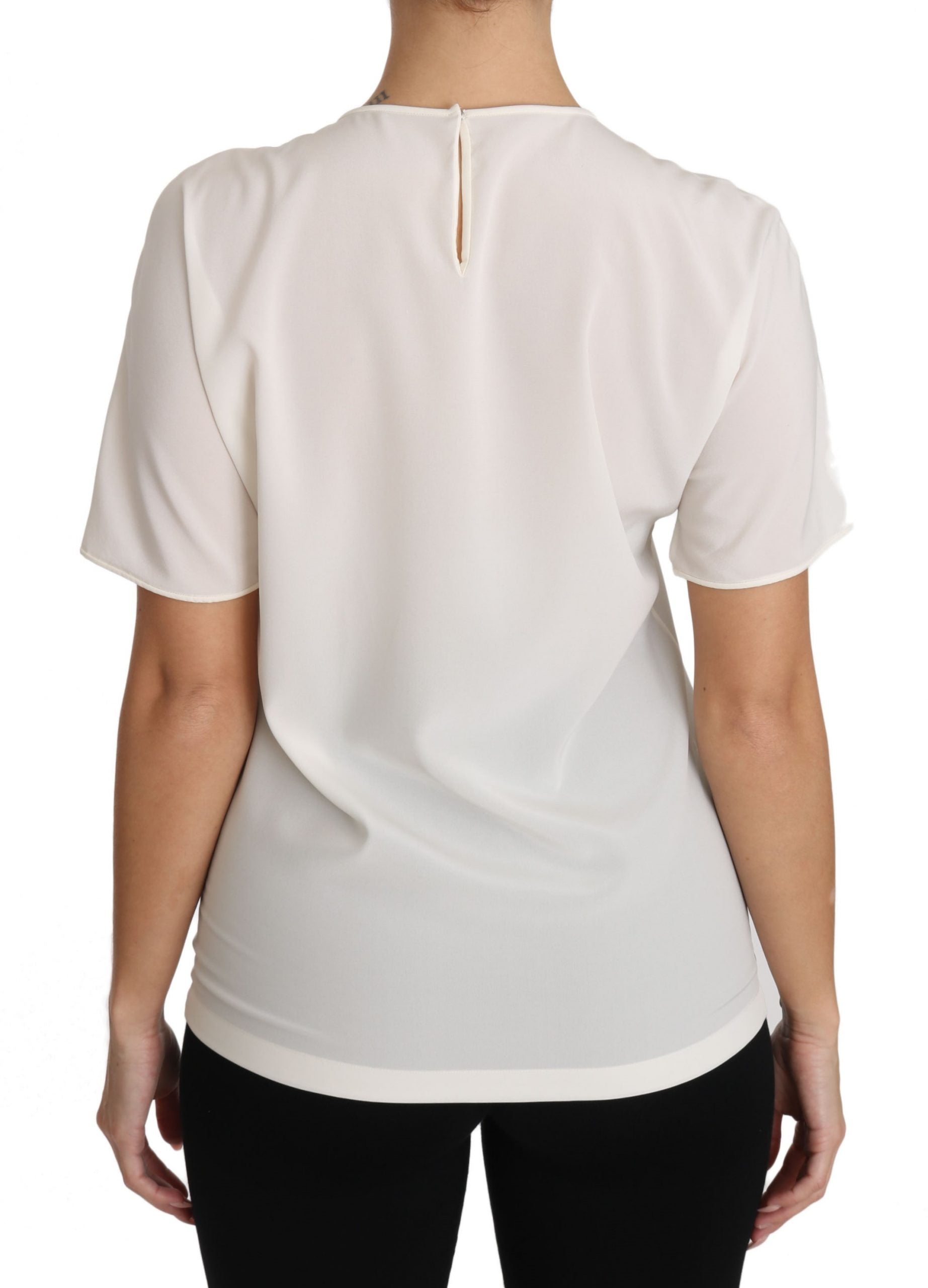 Blusa elegante de seda con cuello redondo y apliques