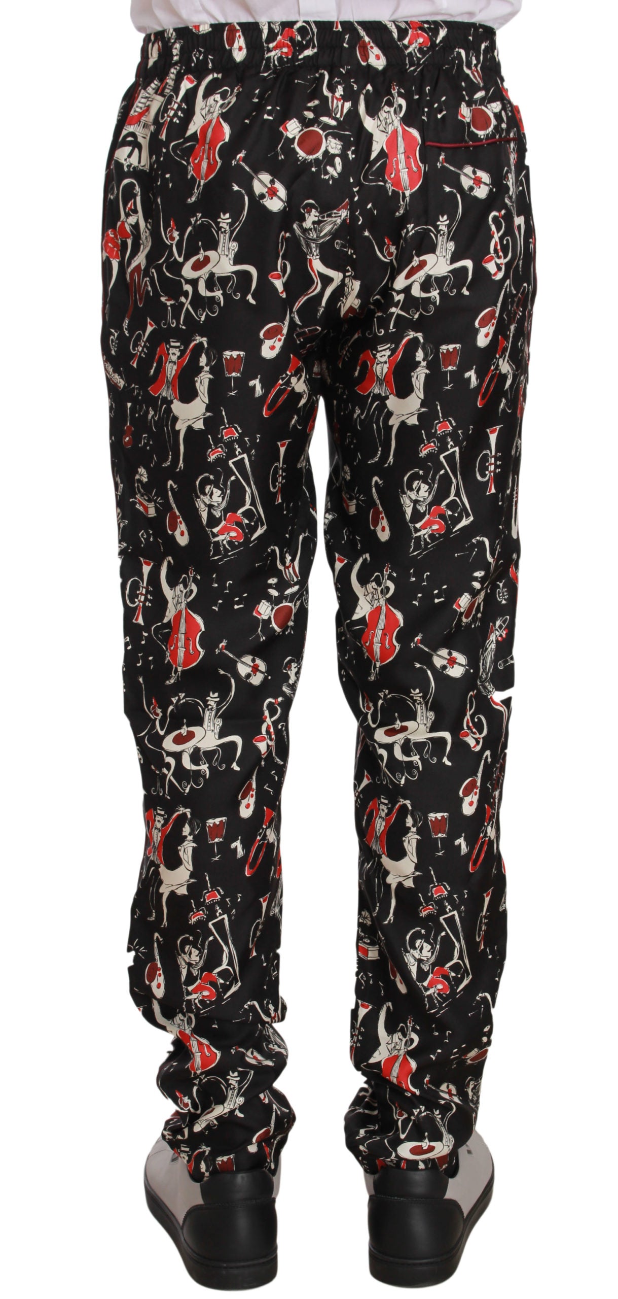 Elegante pantalón lounge de seda negro con estampado rojo